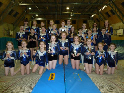 Members posing with January 2012 trophies and medals