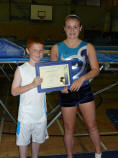 Joshua Newman receiving JP award from Hannah McCann
