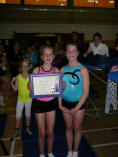 Victoria Webb geting her certificate from 'Big Sis'